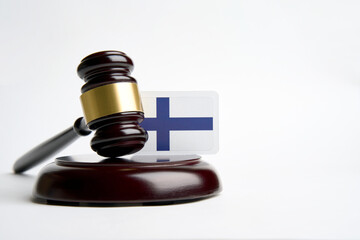 Legal law concept image, judge gavel and flag of Finland