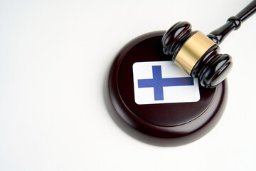 Legal law concept image, judge gavel and flag of Finland