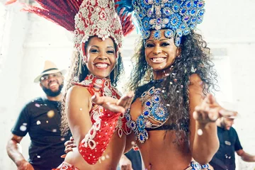  Black women, samba dance and carnival party in Brazil for dancing festival, music event show and crazy new year celebration. Rio De Janeiro, happy face smile and portrait of latin Brazilian culture © T Chithambo/peopleimages.com