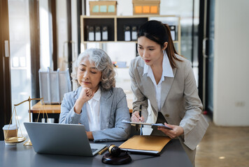 Teamwork of business lawyer meeting working hard about legal legislation in courtroom to help their customer.