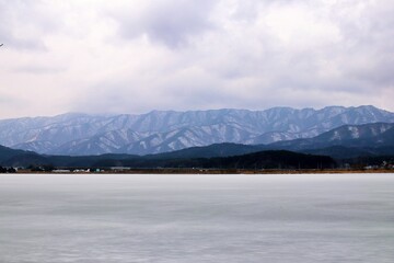 lake and mountains in winter