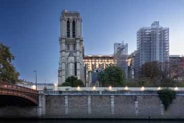 Fototapeta na wymiar Renovated Notre Dame Cathedral in Paris by the Seine River at dawn, France