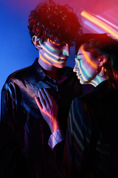 Young couple in neon light
