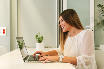 Young Woman Working with a Laptop