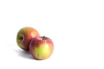 Two fuji apples isolated on a white background. Close up. Free space for your text.