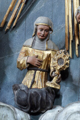 Statue of Saint on the altar of Fourteen holy helpers in the church of St. Catherine of Alexandria...