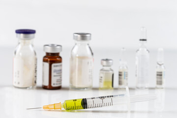 Medical glass vials and syringe for vaccination.