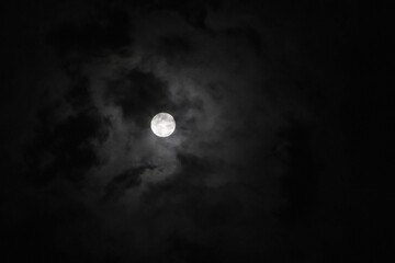full moon covered by clouds