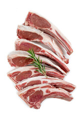 Lamb chops in vertical close-up on a cropped white background.