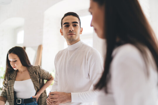 Friendly coworkers talking to each other during break at work