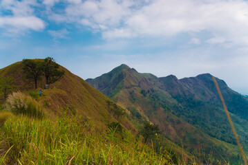 Fototapeta premium Mountain landscape with sunset time of Khao Chang Phuak tropical mountain of Thong Pha Phum National Park Kanchanaburi, Thailand