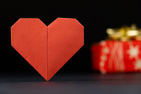 Origami For Valentine's Day - Red Paper Heart And Gift On A Black Background Do It Yourself, DIY.