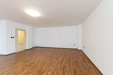 Empty bright living room. New home. Beautiful apartment interior. Wooden floor