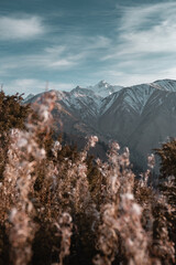 Mountains landscape with some people hiking. Sunset or sunrise in mountains. 