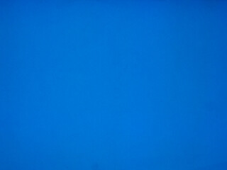 Blurred backdrop place for text. Bright blue color. Random halftone,pattern irregular abstract halftone. Cobalt blue. Blue.