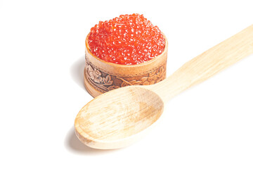 delicious red caviar in wooden bowl isolated on white background.