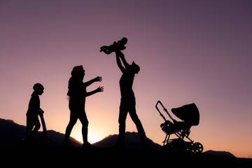 mother, father and happy children travel and happy times in nature