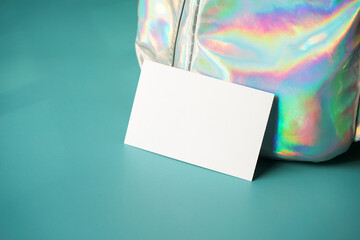 Mockup of a business card with a holographic texture as background