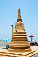sand pagoda was carefully built, and beautifully decorated by crown flower in Songkran festival