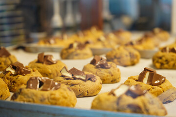 Baking tray with tasty cookies taken out from oven at a bakery shop.
