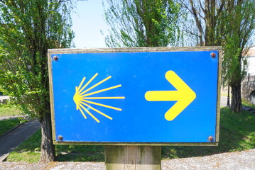 Way of St James , Camino de Santiago , yellow arrow sign to Compostela , Galicia, Spain