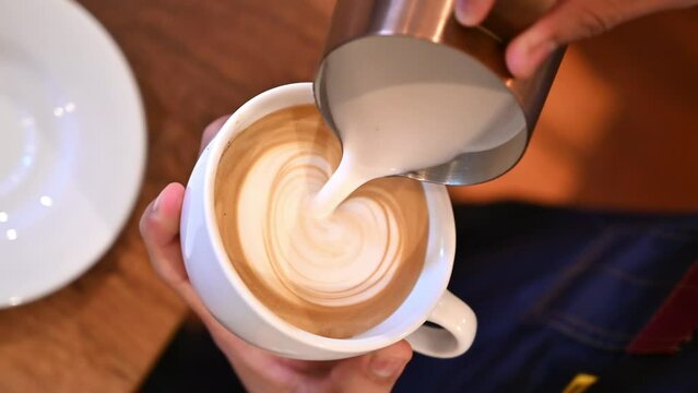 Professional Barista Pour fresh milk Create image on coffee latte art