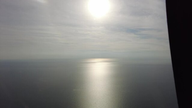 Side Helicopter View With Rotors In Frame Of Beautiful Ocean Scenic Waterscape
