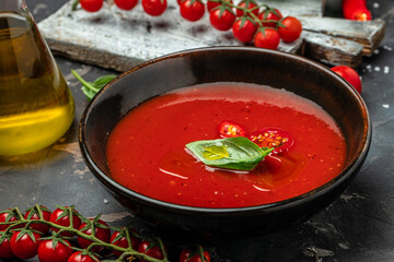 Spicy Homemade Gazpacho Soup. Summer cold vegan food on a dark background. banner, menu, recipe place for text, top view