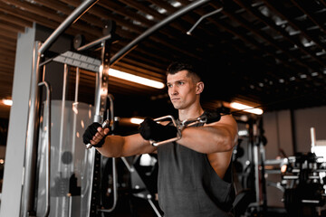 Fototapeta na wymiar Gym concept with male model and various training equipment
