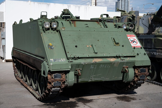 Detail of a small tracked light armored vehicle FMC Corporation M106 in camouflage green
