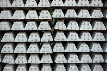 Stacks of concrete railway sleepers at the construction site of a new railway. Investments in rail transport as the basis for development.