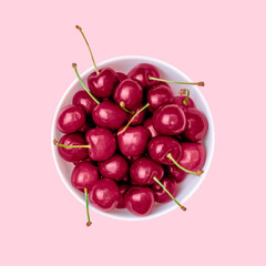 Viva Magenta color of the year 2023. .Close-up of ripe cherries on a pink background. - obrazy, fototapety, plakaty