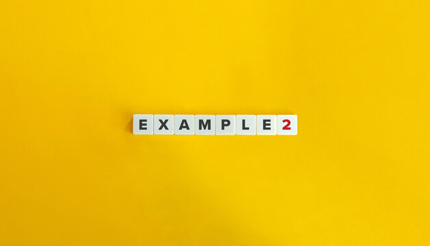 Example 2 (Two) Text on Block Letter Tiles on Yellow Background. Minimal Aesthetics.
