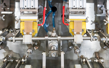 Close up heater of seal unit component of filling packing and sealing machine for food and beverage such as egg tofu sauce cleaning detergent cosmetic oil shampoo lotion etc. in manufacturing process