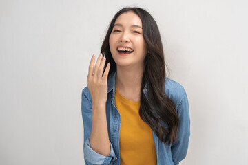 Smiling positive, attractive asian young woman wearing casual dress, portrait of beautiful brunette her with long black hair, feeling happy looking at camera standing isolated on white background.