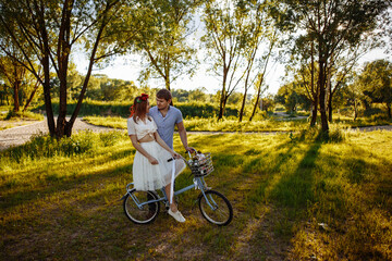 Fototapeta premium Loving couple on vintage bike