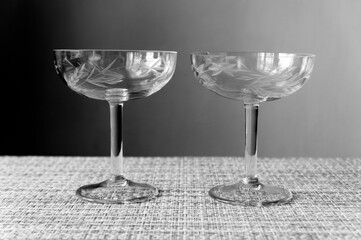 Glass glasses for dessert on the table. Black and white