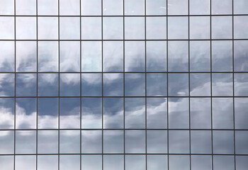 Sky reflecting in windows of office building