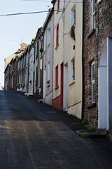 Fototapeta na wymiar Old narrow street in County Wexford, Ireland with traditional small houses.