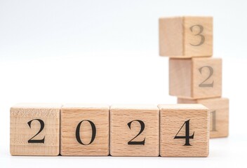 The number 2024 in wooden block cubes isolated on a white background. new year concept