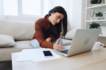 Woman working from home freelance in laptop online, overwork and fall depression from lack of vitamins