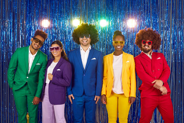 Men and women happy laughing people in sunglasses and colourful suits in gangnam style on blue...