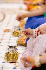 Indian woman having ceremonial actions at temple
