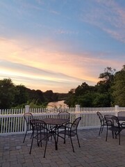 Setting for Dining al Fresco with a sunset on the cape