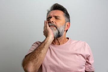 Close up photo amazing he him his middle age macho hand arm hold cheekbone teeth terrible pain injury sadness cry facial expression weakness wear casual white t-shirt isolated grey background