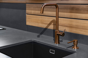 Sink and faucet in the kitchen in black