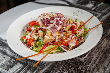 Fresh caesar salad on a plate close-up