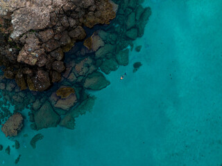Fototapeta na wymiar Aerial views with person snorkeling off the coast of Europe