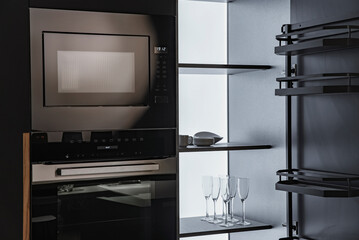 Glasses and appliances, in the kitchen set with lighting