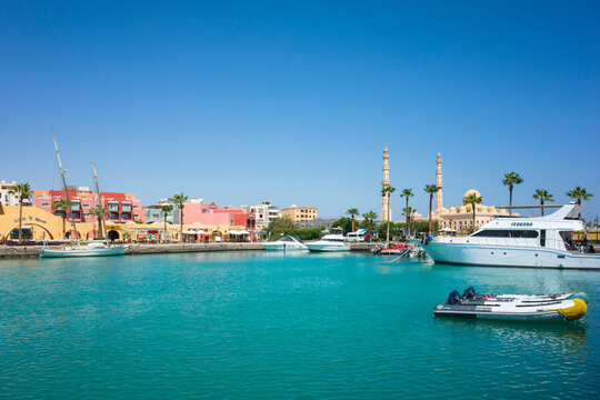 Hurghada, Red Sea Governorate, Egypt - September 21, 2022: Hurghada Marina turquoise water in harbor, El Mina Mosque